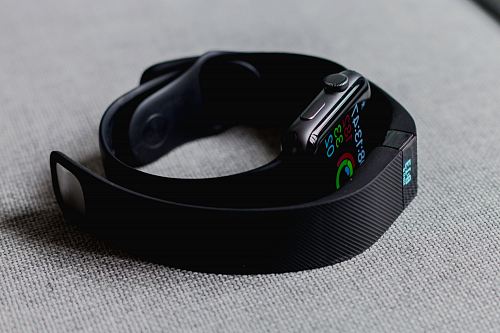 black aluminum case Apple Watch and black Fitbit charge 2